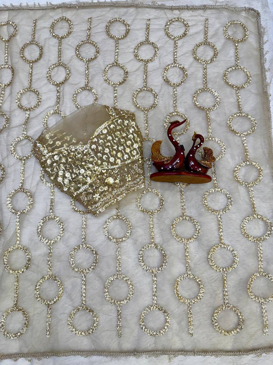 Beige Net Saree with All-Over Gold Ring Beads Embroidery Work